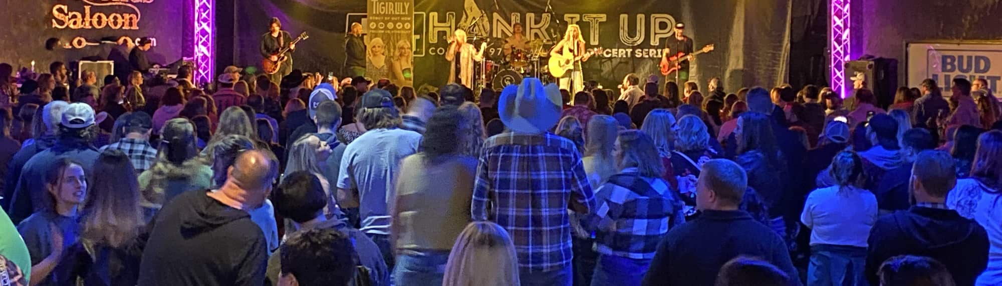 country concert with fans wearing cowboy hats Seattle