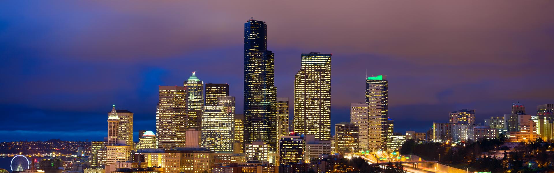 Neon color image of a band playing and people singing along